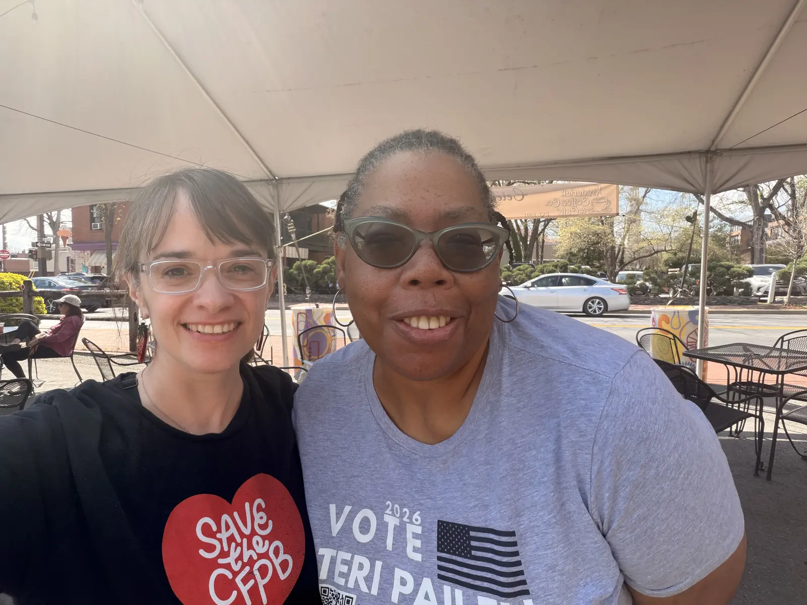Teri Pailen with a supporter at an outdoor community event.